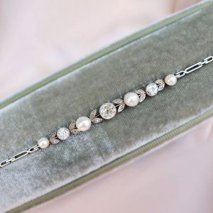 Elegant Round Cut Pearl & White Sapphire Bracelet