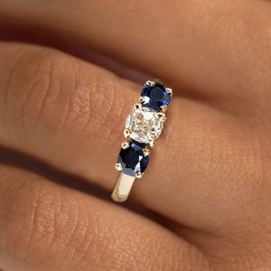 Golden Three Stone Cushion Cut White & Blue Sapphire Wedding Band For Women