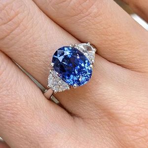 Three Stone Oval Cut Blue Sapphire Engagement Ring For Women