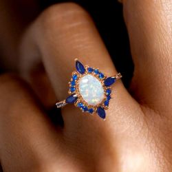 Rose Gold Halo Oval Cut Opal & Blue Sapphire Engagement Ring